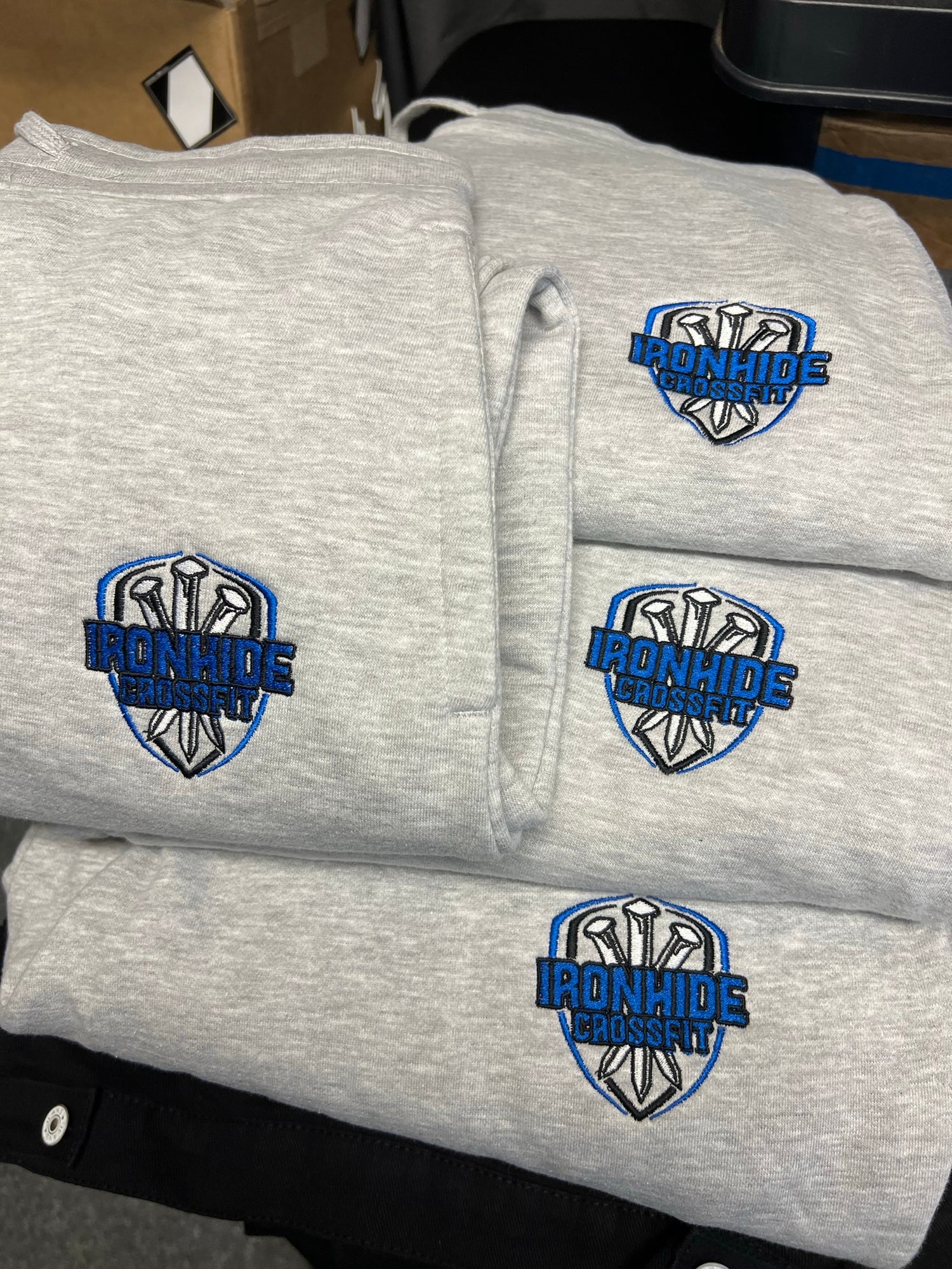 Hoodie with a crossfit company as logo